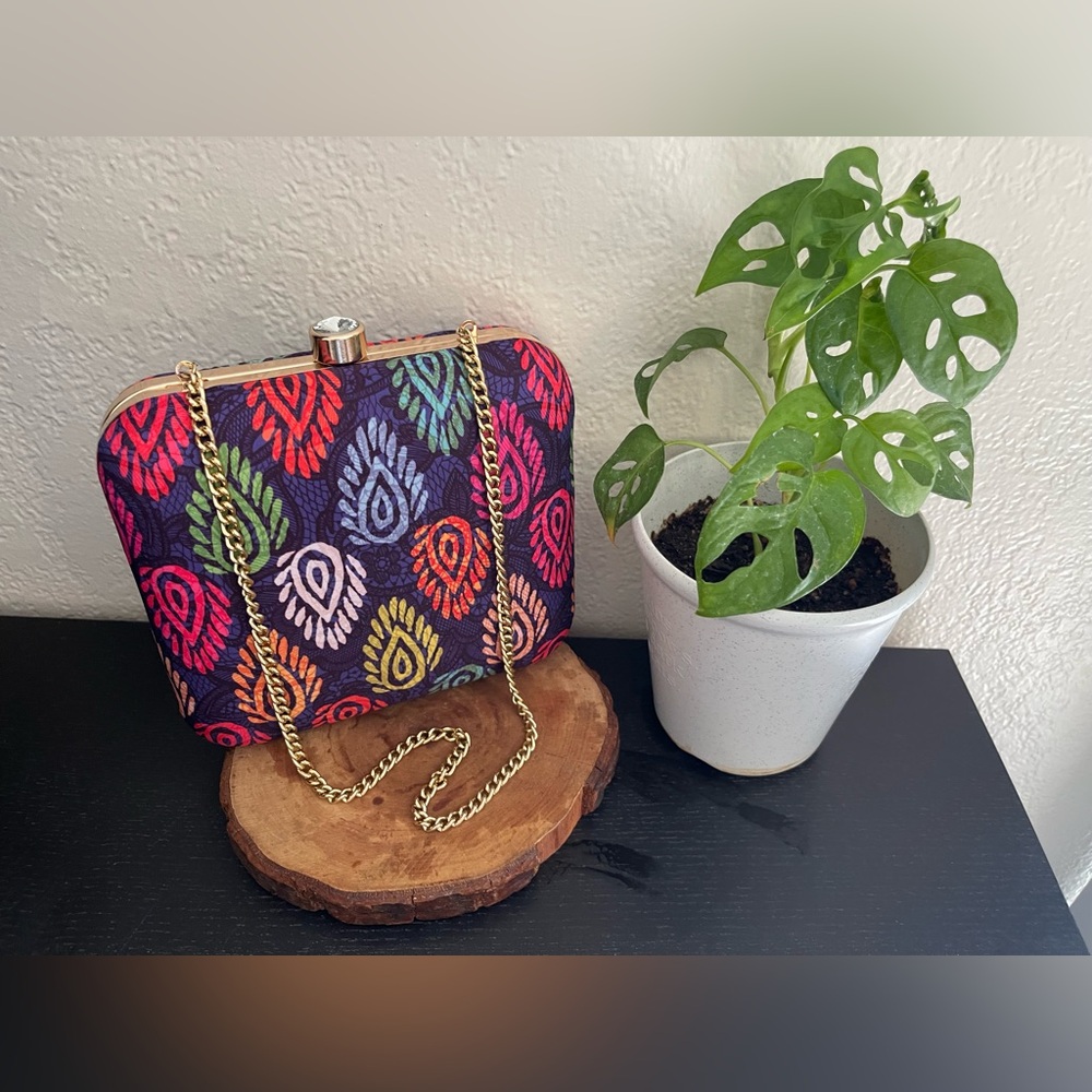 Saiesha box clutch with a sling chain amazingly perfect and elegant